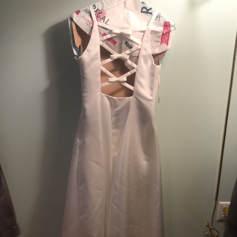 Long elegant wedding gown (long white gown) with cross back detail.